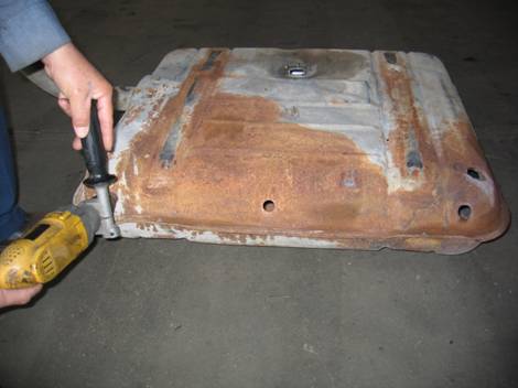 What is involved in repairing an auto gas tank?